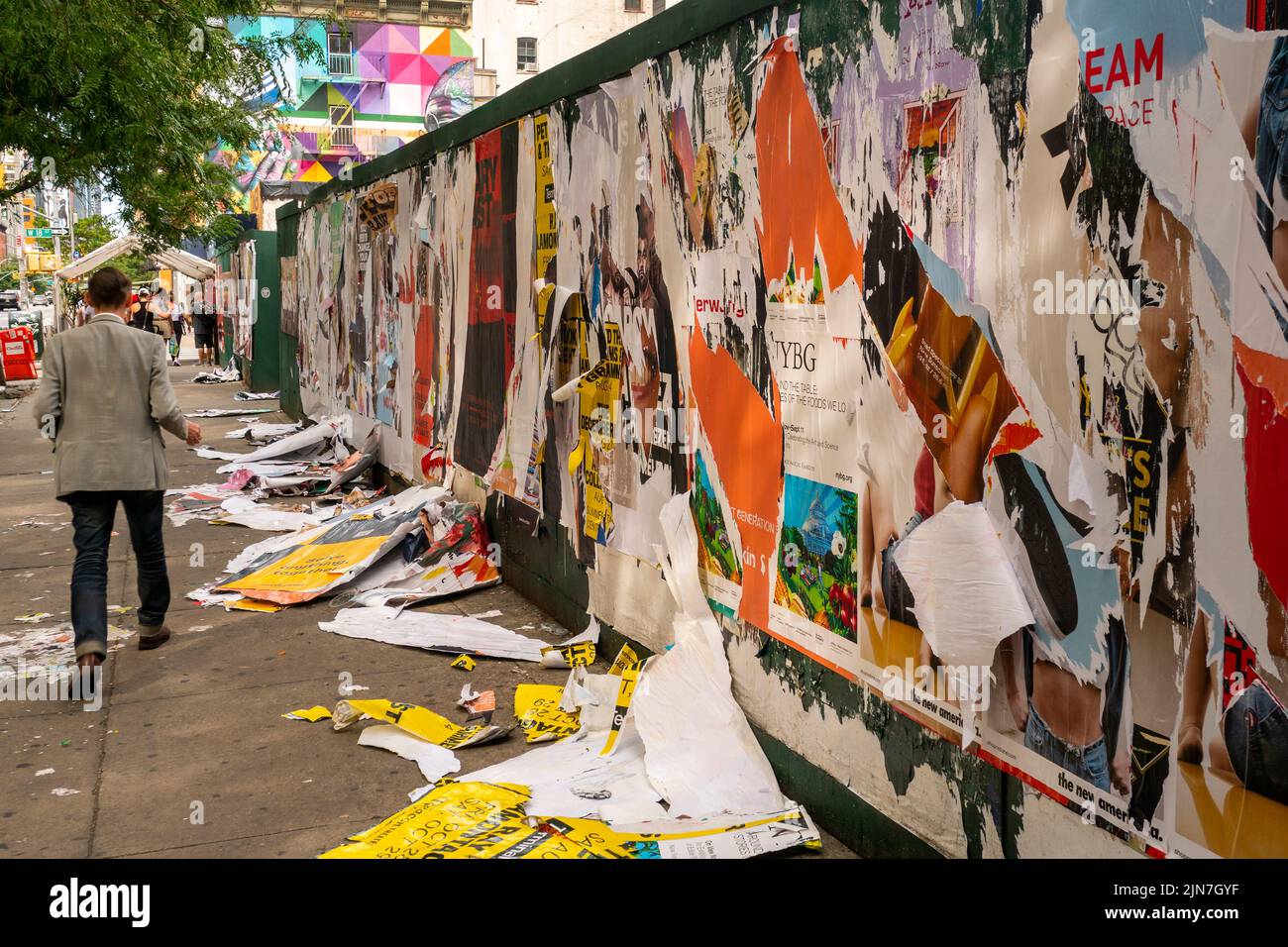 Wheatpasted advertising posters removed from a sidewalk shed in front of a construction site in New York on Tuesday, July 26, 2022.  (© Richard B. Levine) Stock Photo