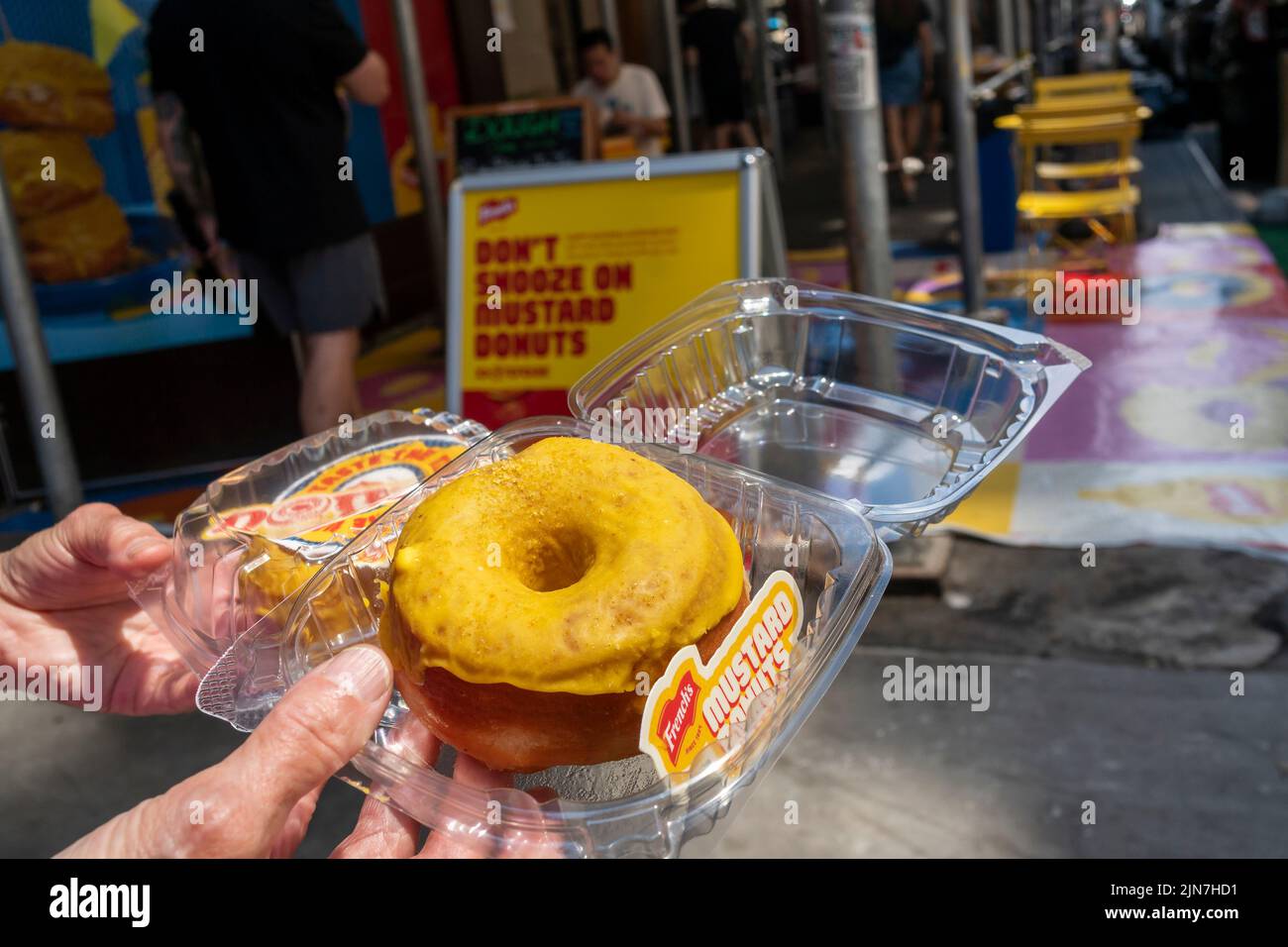 People arrive at the Dough store in the Flatiron neighborhood in New