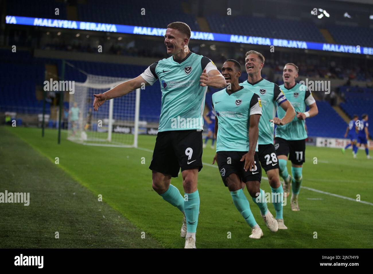 Cardiff, UK. 09th Aug, 2022. Colby Bishop of Portsmouth (9) celebrates with teammates after he scores their 3rd goal . EFL Carabao cup round 1 match, Cardiff city v Portsmouth at the Cardiff City Stadium in Cardiff, Wales on Tuesday 9th August 2022. this image may only be used for Editorial purposes. Editorial use only, license required for commercial use. No use in betting, games or a single club/league/player publications. pic by Andrew Orchard/Andrew Orchard sports photography/Alamy Live news Credit: Andrew Orchard sports photography/Alamy Live News Stock Photo