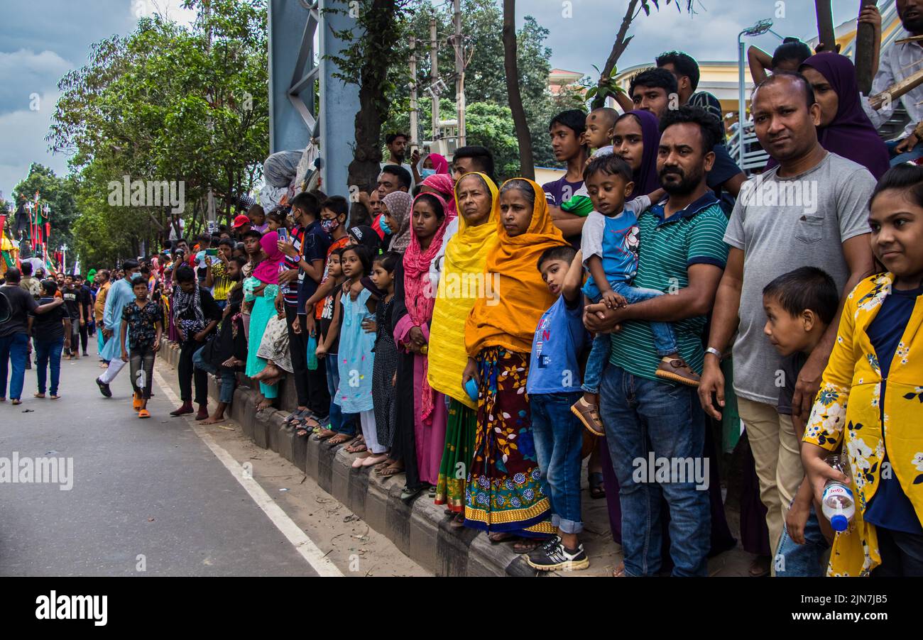Bangladeshi Shia Muslims march and carry the flags and Tazia during a