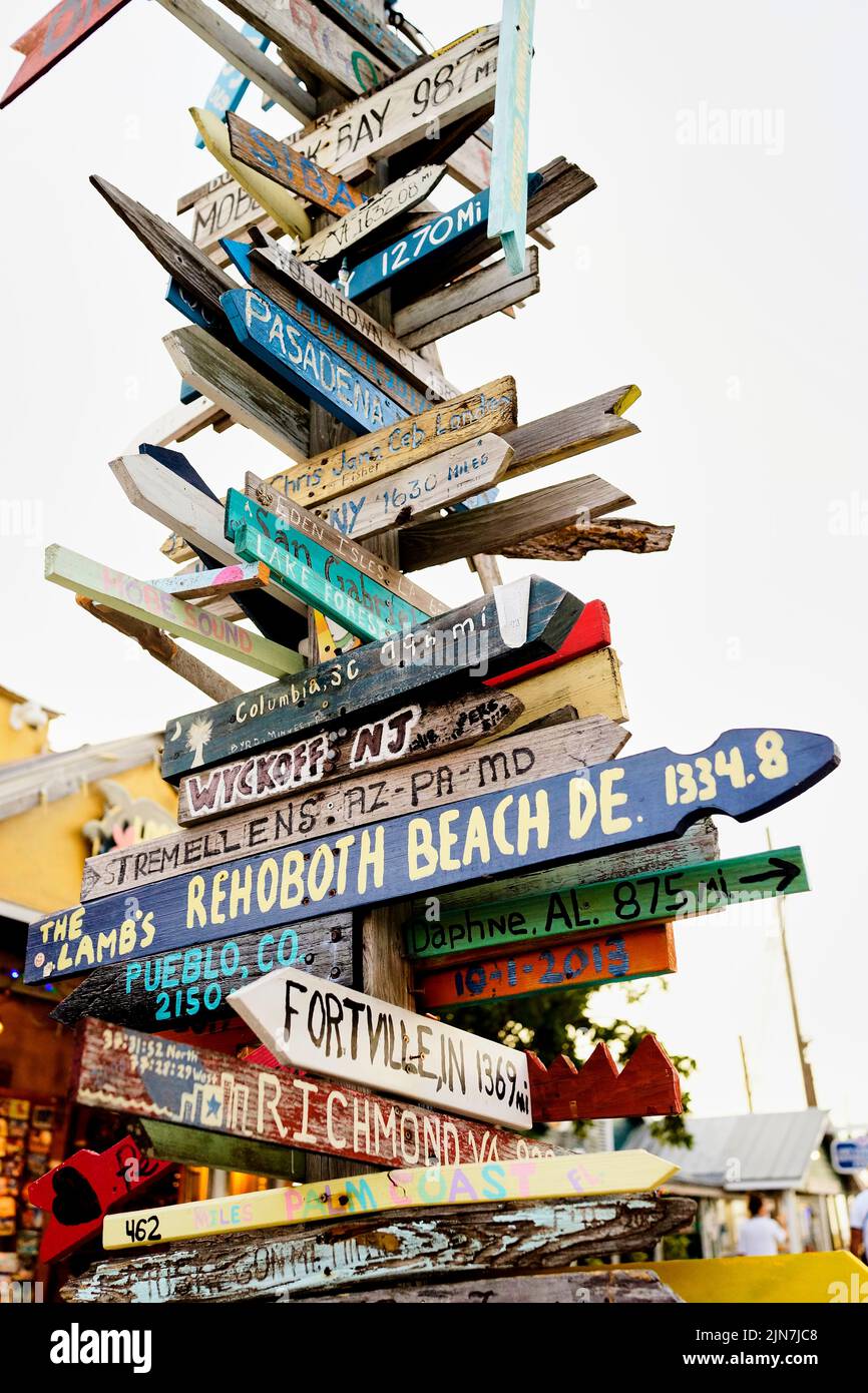 Directional sign in Key West, Florida, FL, USA.  Hand painted, hand made, directional distance arrows Stock Photo