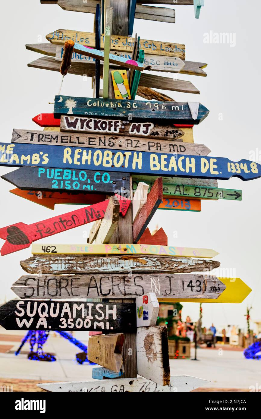 Directional sign in Key West, Florida, FL, USA.  Hand painted, hand made, directional distance arrows Stock Photo