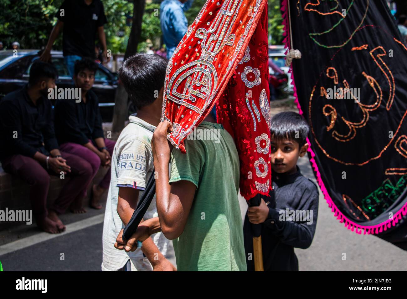Bangladeshi Shia Muslims march and carry the flags and Tazia during a ...