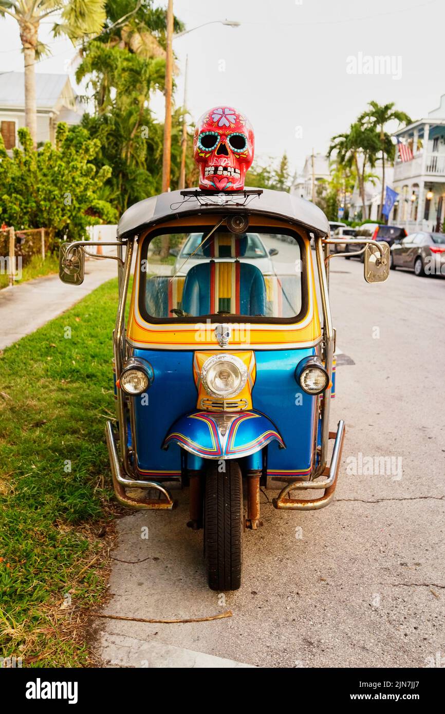 Motor scooter taxi in Key West, Florida, FL, USA. With red decorated