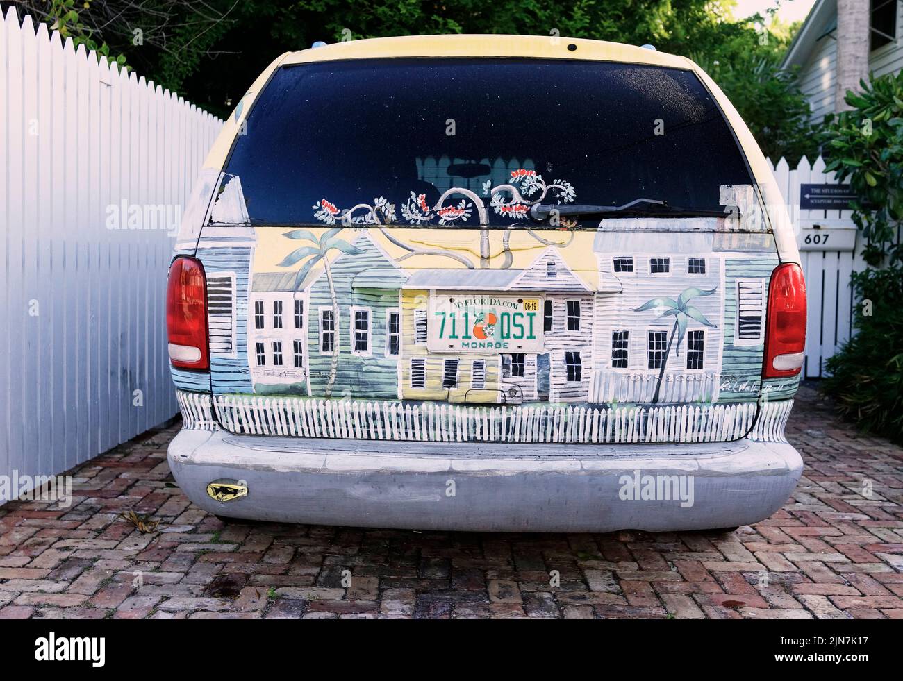 Painted car in Key West, Florida, FL, USA. Old Conch house painted on