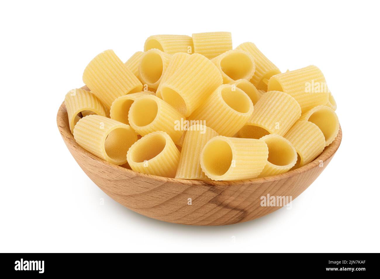 raw italian pasta in wooden bowl isolated on white background. Mezze Maniche Rigate Bronze die Stock Photo
