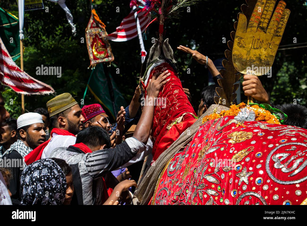 Bangladeshi Shia Muslims march and carry the flags and Tazia during a ...