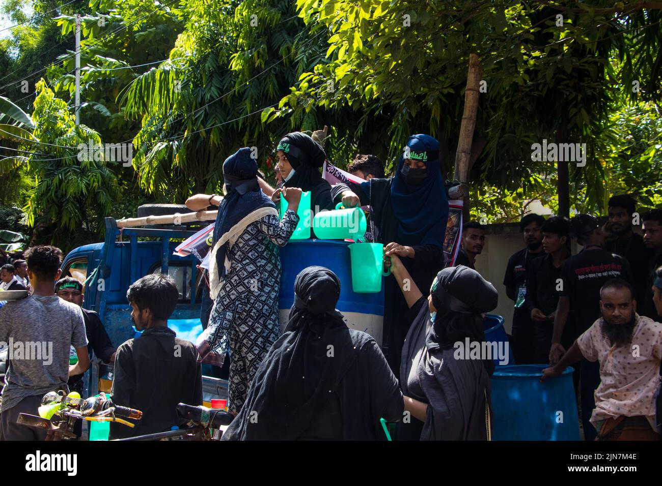 Bangladeshi Shia Muslims march and carry the flags and Tazia during a ...