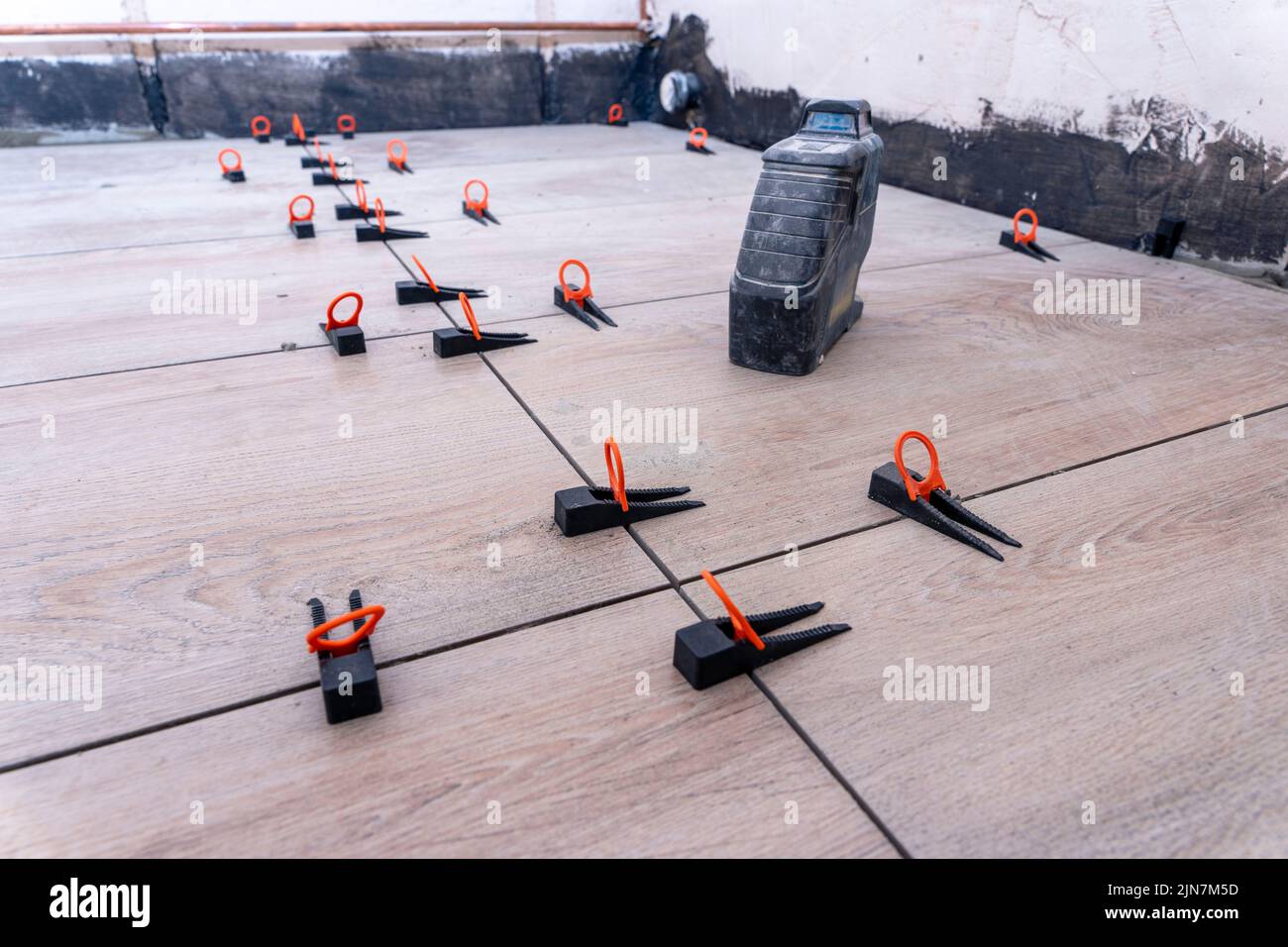 bathroom floor during renovation with the tile alignment system Stock Photo