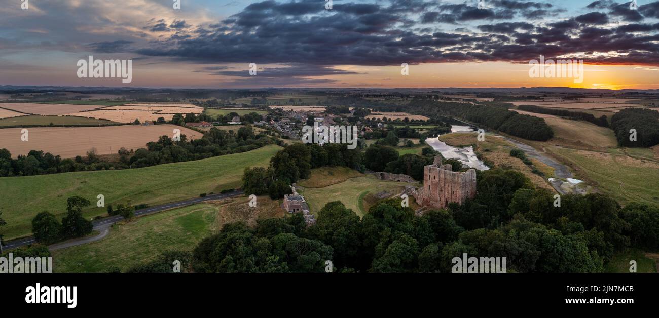 Aerial view at sunset of Norham Castle one of the most important fortresses defending the Anglo Scottish border. Northumberland, England Stock Photo
