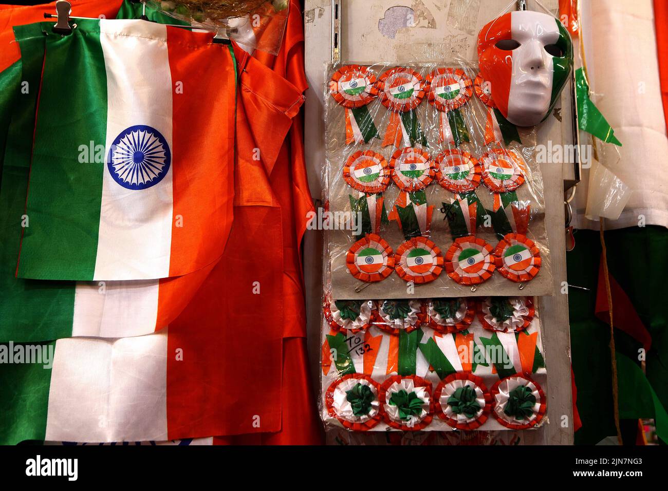 Old Delhi, Delhi, India. 26th July, 2022. A shopkeeper sells National Flag of India and other usable articles, with a tricolor in Delhi as a huge demand of these articles arose this year, as India celebrating 75 years of Independence. (Credit Image: © Ranjan Basu/Pacific Press via ZUMA Press Wire) Stock Photo