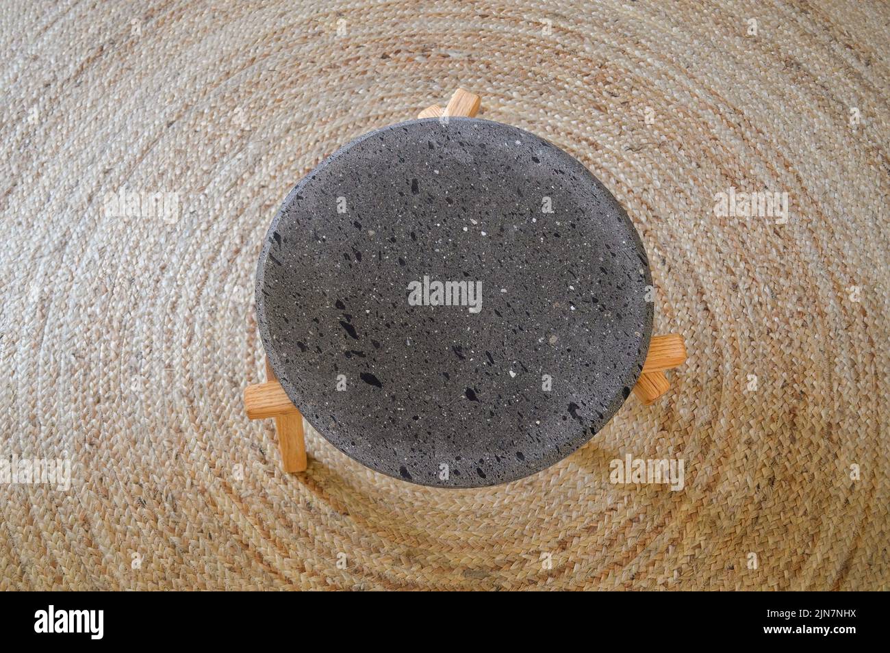 Balcanic Rug Designer small coffee table from volcanic stone with wooden legs on a ...