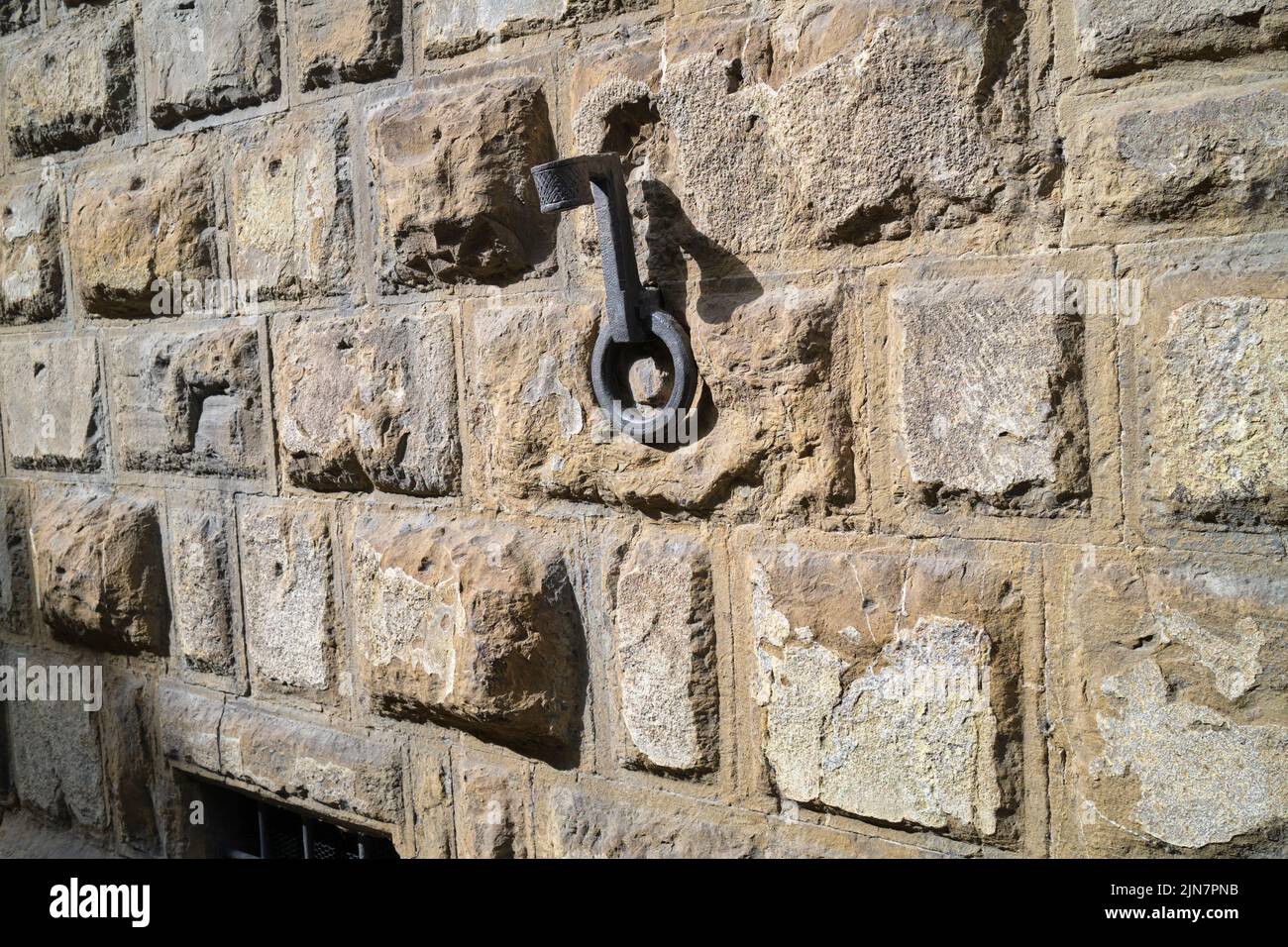 Cast Iron Torch Holders and Horse Tethers on the exterior of an historic building in Florence Italy Stock Photo