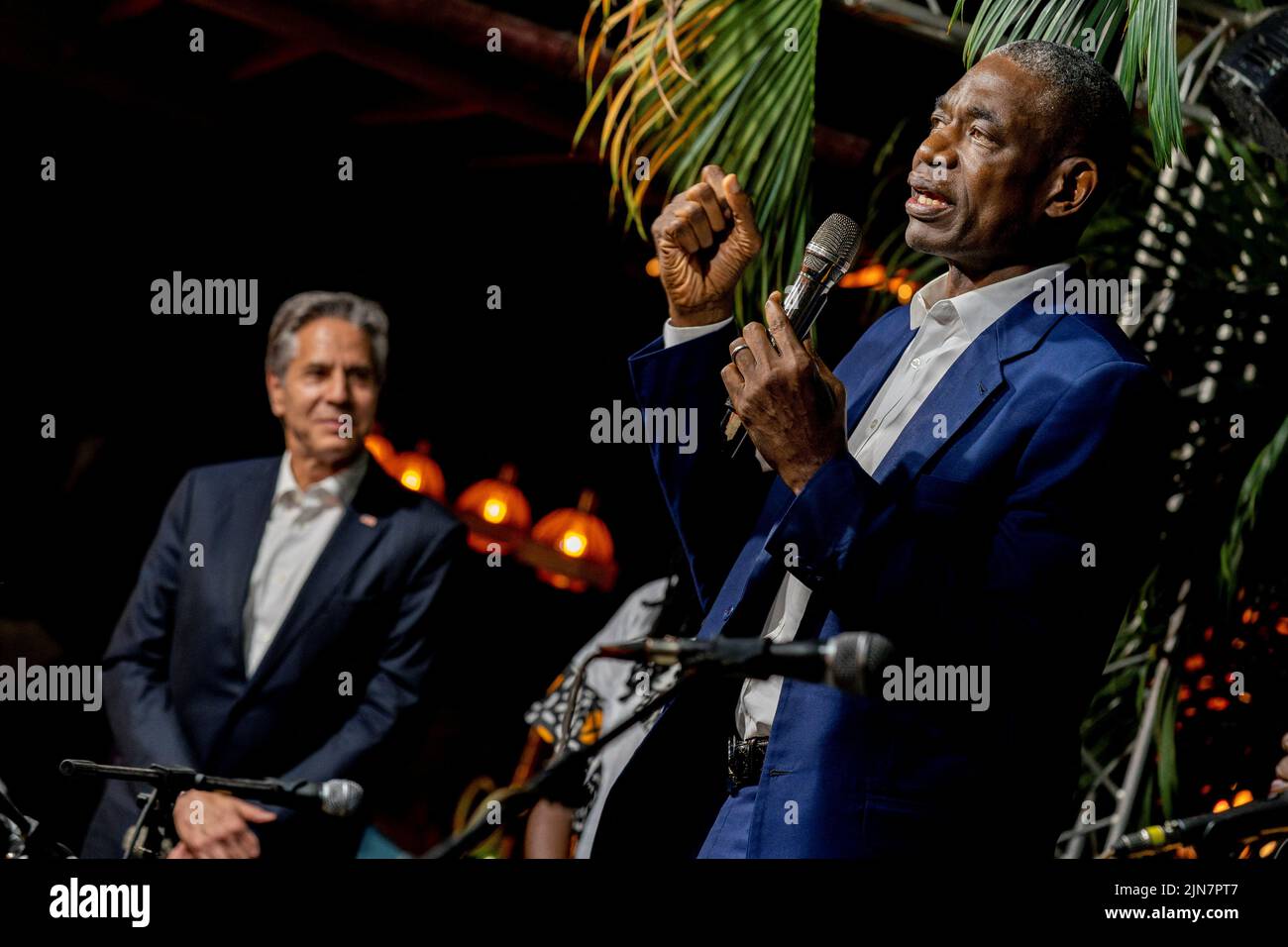 Former NBA basketball superstar and Congo native Dikembe Mutombo, accompanied by U.S. Secretary of State Antony Blinken, takes the stage with the “Rainbow Band” to say a few words at Villa Kilimanjaro in Kinshasa, Democratic Republic of the Congo, August 9, 2022. Andrew Harnik/Pool via REUTERS Stock Photo