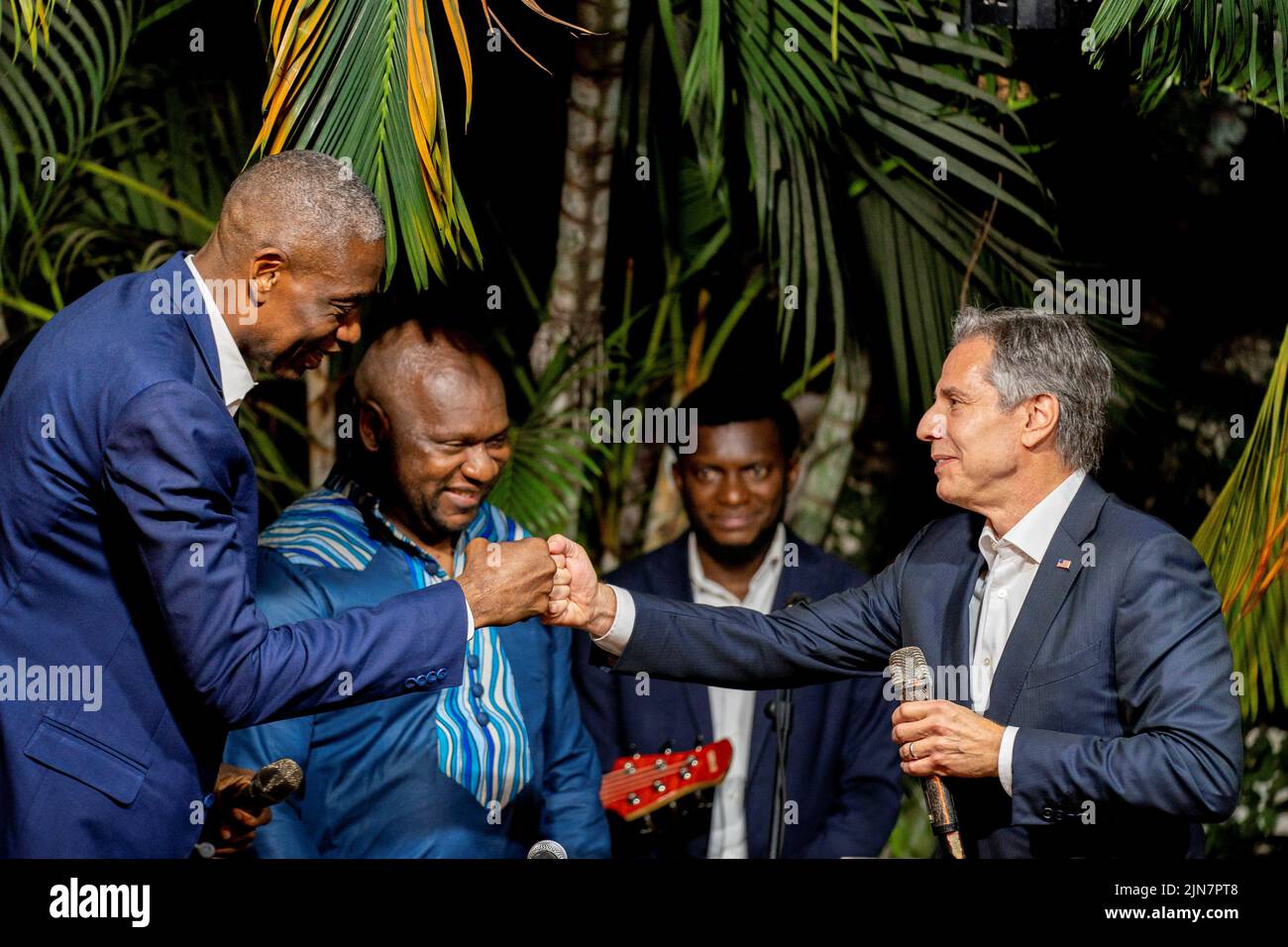 U.S. Secretary of State Antony Blinken greets former NBA basketball superstar and Congo native Dikembe Mutombo as they take the stage with the “Rainbow Band” to say a few words at Villa Kilimanjaro in Kinshasa, Democratic Republic of the Congo, August 9, 2022. Andrew Harnik/Pool via REUTERS Stock Photo