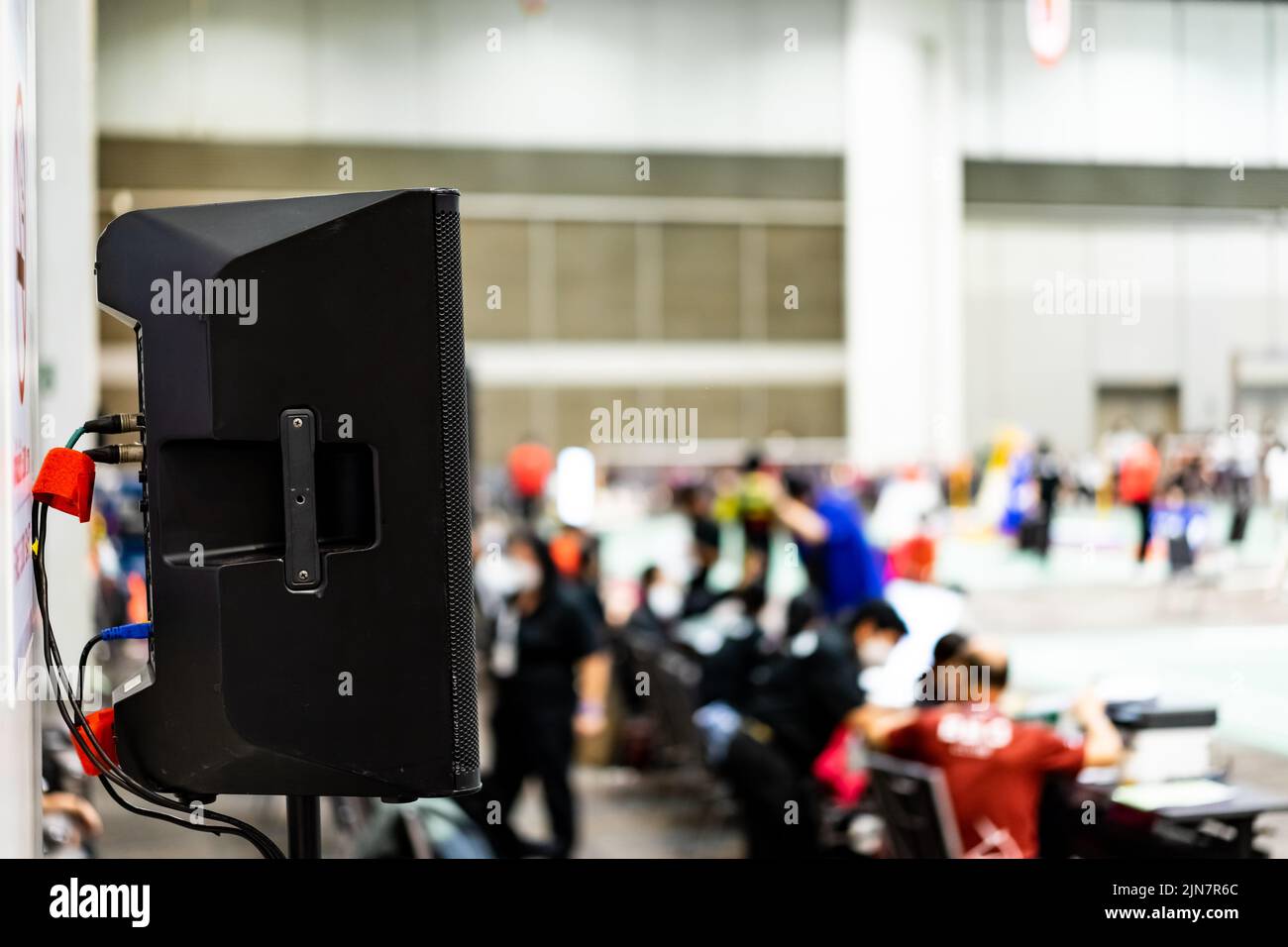 The black speaker set against a white wall with blurred background is used for voice acting in sports stadiums. The sound is clear and loud, so the ac Stock Photo