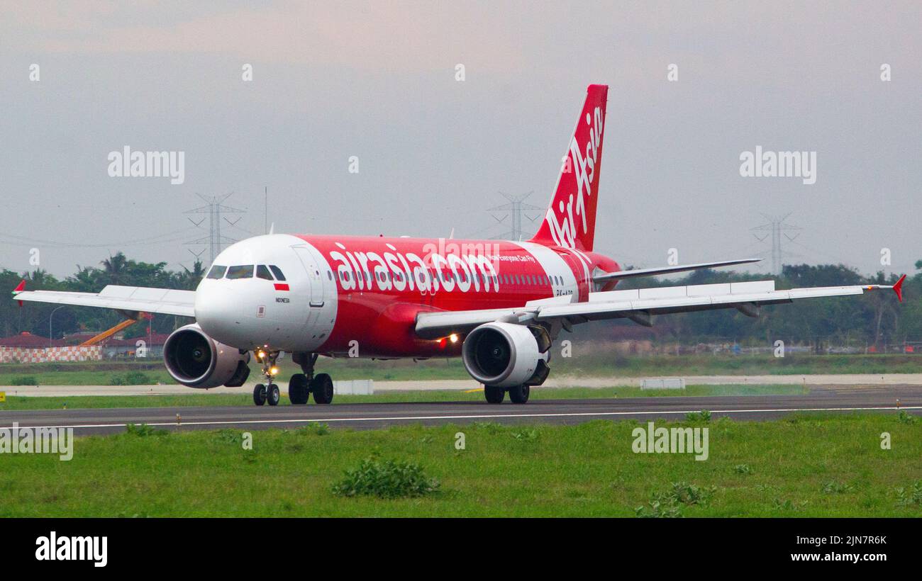 Indonesia AirAsia (QZ/AWQ) Airbus A320-216 PK-AZP ex Thai AirAsia HS-ABB (MSN: 3299) landing at runway 29 Yogyakarta International Airport (YIA/WAHI) Stock Photo