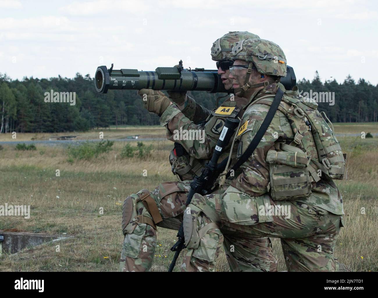 U.S. Army Spc. Tyler Graessle ,left, and Staff Sgt. Thomas Schneider both assigned to the Southern European Task Force (SEATAF) take aim with an M1-36 recoilless rifle during the 2022 U.S. Army Europe and Africa Best Squad Competition on Grafenwoehr Training Area, Germany Aug. 9, 2022. Teams from across USAREUR-AF test their tactical proficiency, communication, and overall cohesion as they compete for the title of Best Squad. Winners of this competition will advance to represent USAREUR-AF at the U.S. Army Best Squad Competition at Fort Bragg, North Carolina later this year. Stock Photo