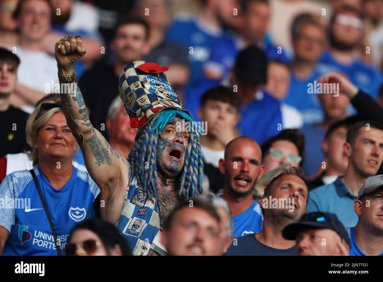 Cardiff, UK. 09th Aug, 2022. Portsmouth FC supporter John Westwood, full name John Anthony Portsmouth Football Club Westwood looks on from the away stand. EFL Carabao cup round 1 match, Cardiff city v Portsmouth at the Cardiff City Stadium in Cardiff, Wales on Tuesday 9th August 2022. this image may only be used for Editorial purposes. Editorial use only, license required for commercial use. No use in betting, games or a single club/league/player publications. pic by Andrew Orchard/Andrew Orchard sports photography/Alamy Live news Credit: Andrew Orchard sports photography/Alamy Live News Stock Photo