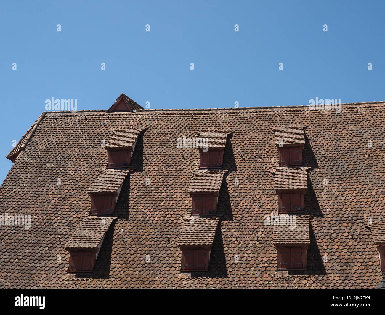 ancient dormer windows in a high roof Stock Photo - Alamy