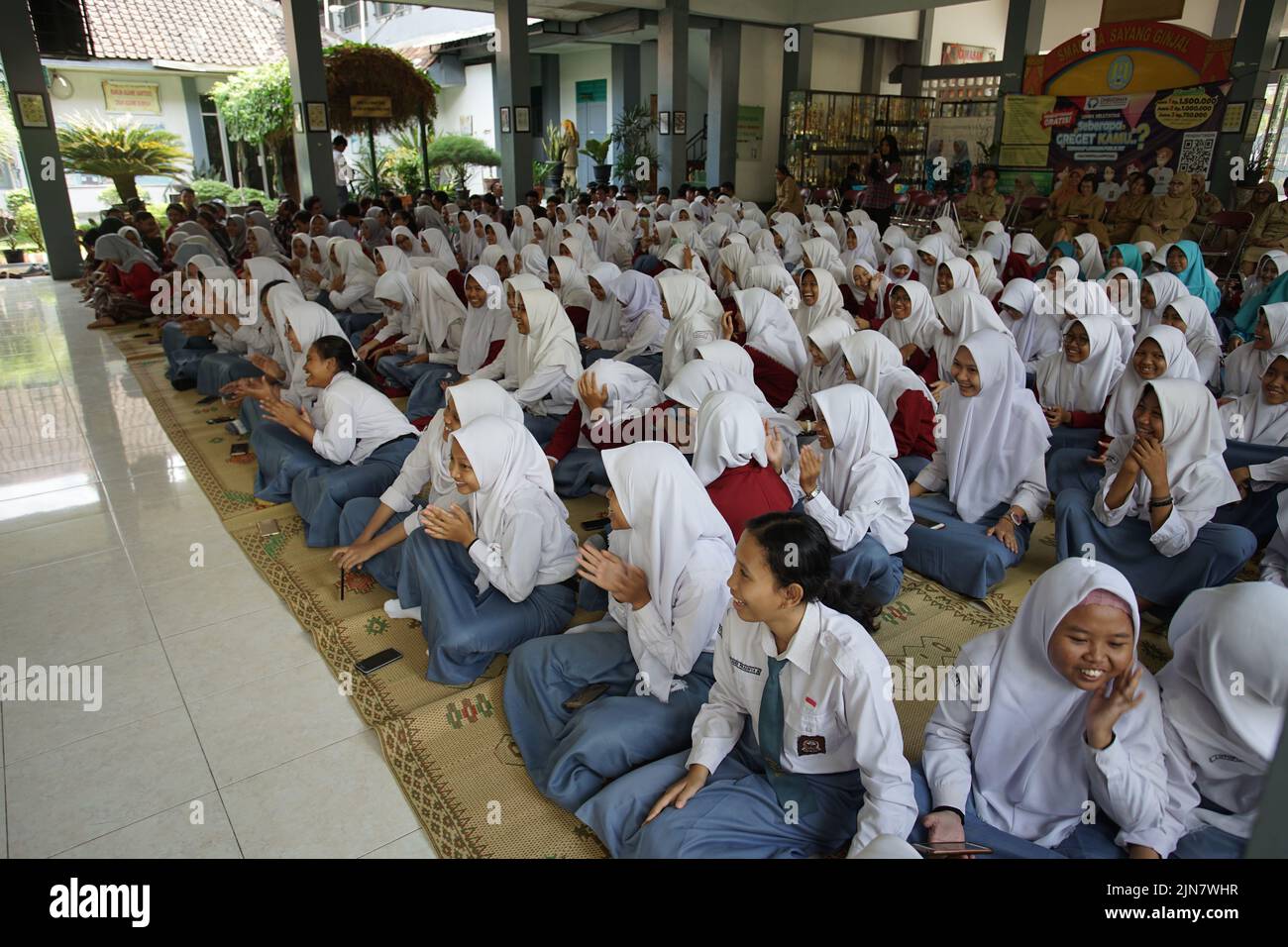 Bantul, Indonesia - Circa 2018: Senior high school students flock at a hall. Stock Photo