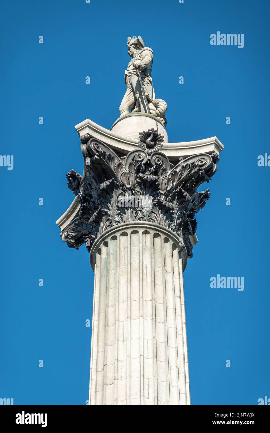 London, UK- July 4, 2022: Trafalgar Square. Closeup of Nelson statue on top of Nelson's Column against blue sky. Stock Photo