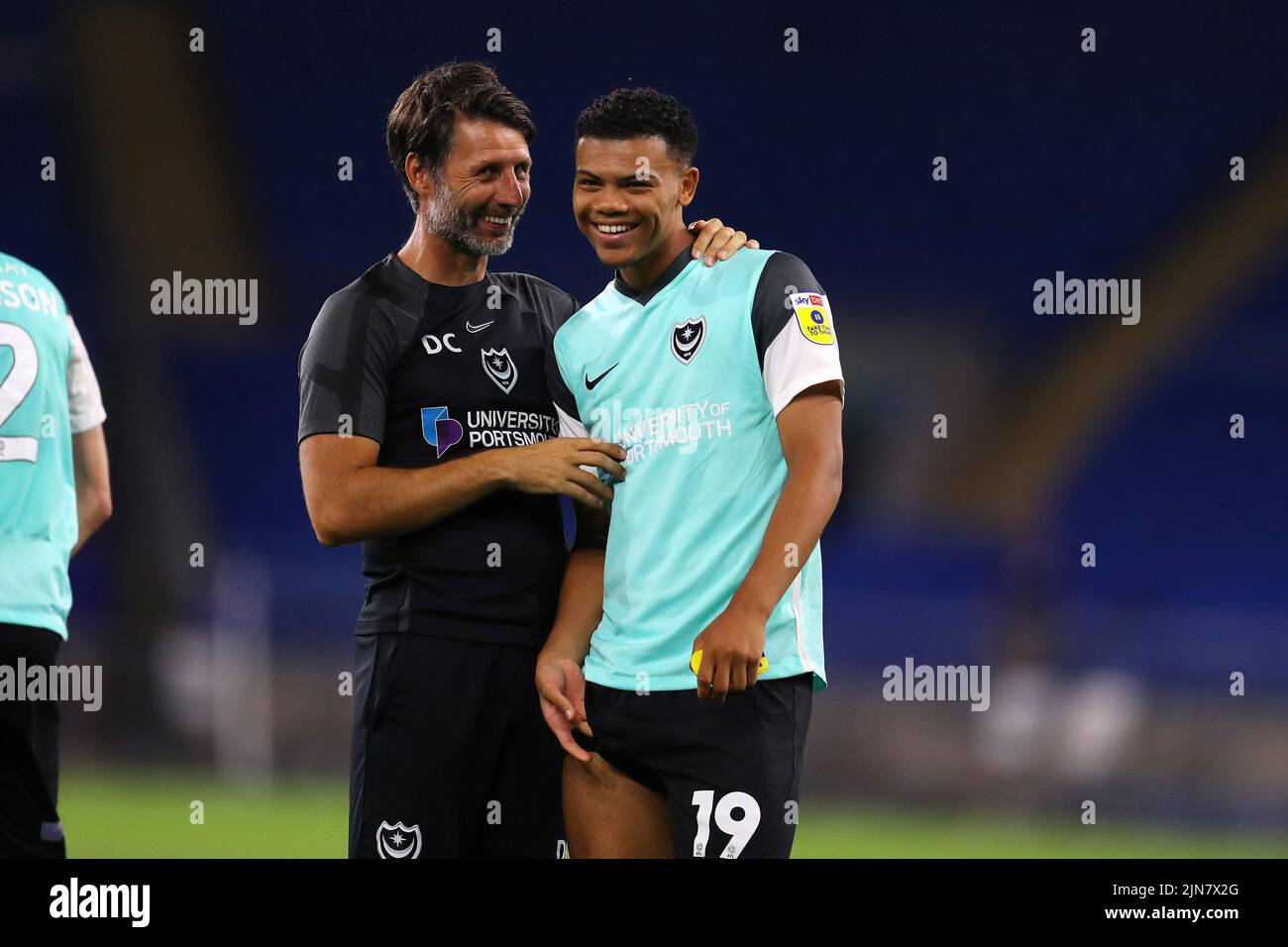 Cardiff, UK. 09th Aug, 2022. Danny Cowley, the manager of Portsmouth FC (l) celebrates with Dane Scarlett of Portsmouth FC after the match. EFL Carabao cup round 1 match, Cardiff city v Portsmouth at the Cardiff City Stadium in Cardiff, Wales on Tuesday 9th August 2022. this image may only be used for Editorial purposes. Editorial use only, license required for commercial use. No use in betting, games or a single club/league/player publications. pic by Andrew Orchard/Andrew Orchard sports photography/Alamy Live news Credit: Andrew Orchard sports photography/Alamy Live News Stock Photo