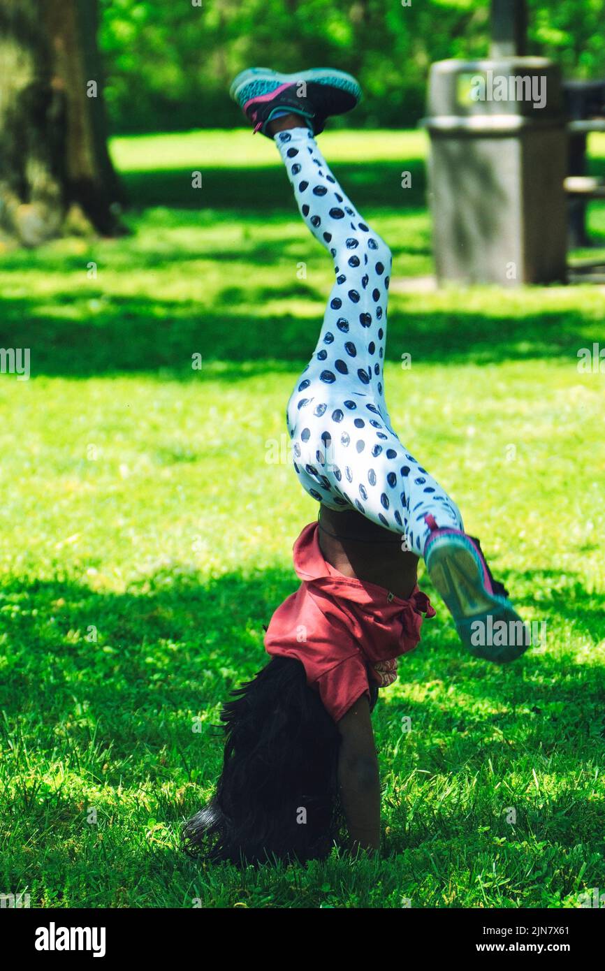 Young girl cartwheel hires stock photography and images Alamy