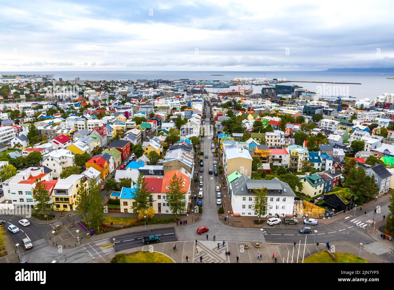 Skyline aerial view of Reykjavik city, Iceland. Skolavordustigur street, downtown, central streets, harbor and ocean scenery beyond the city Stock Photo