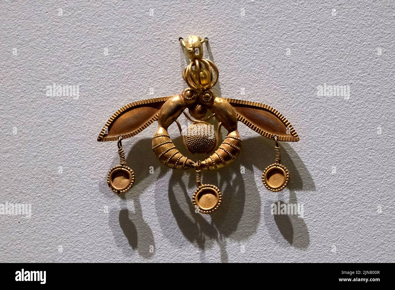 The Bee Pendant, a gold ornament in the Heraklion Archaeological Museum in Crete Greece Stock Photo
