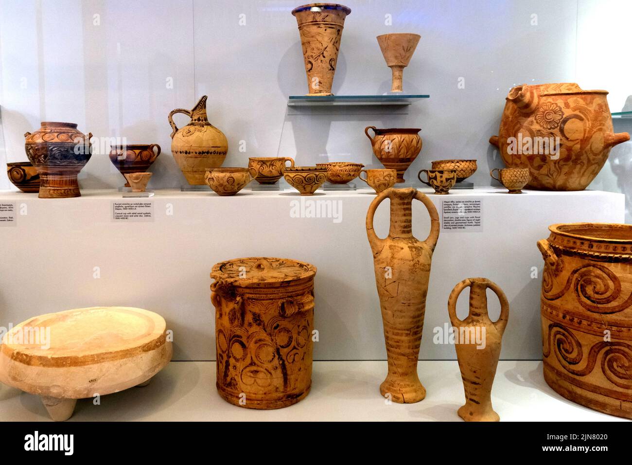 Various pottery jars and vases in the Heraklion Archaeological Museum in Crete Greece Stock Photo