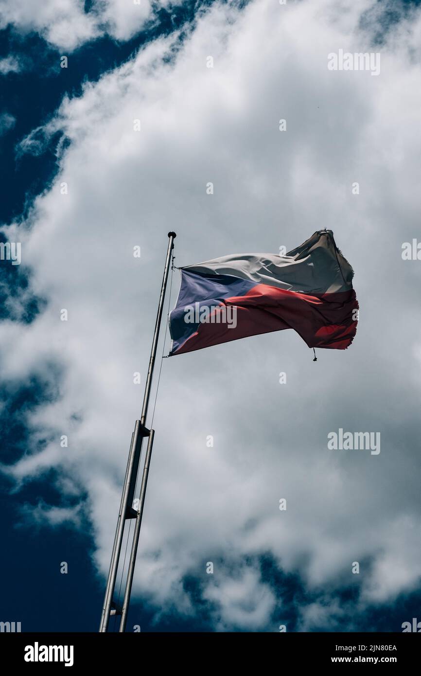 The flag of Russia waving against a cloudy sky Stock Photo