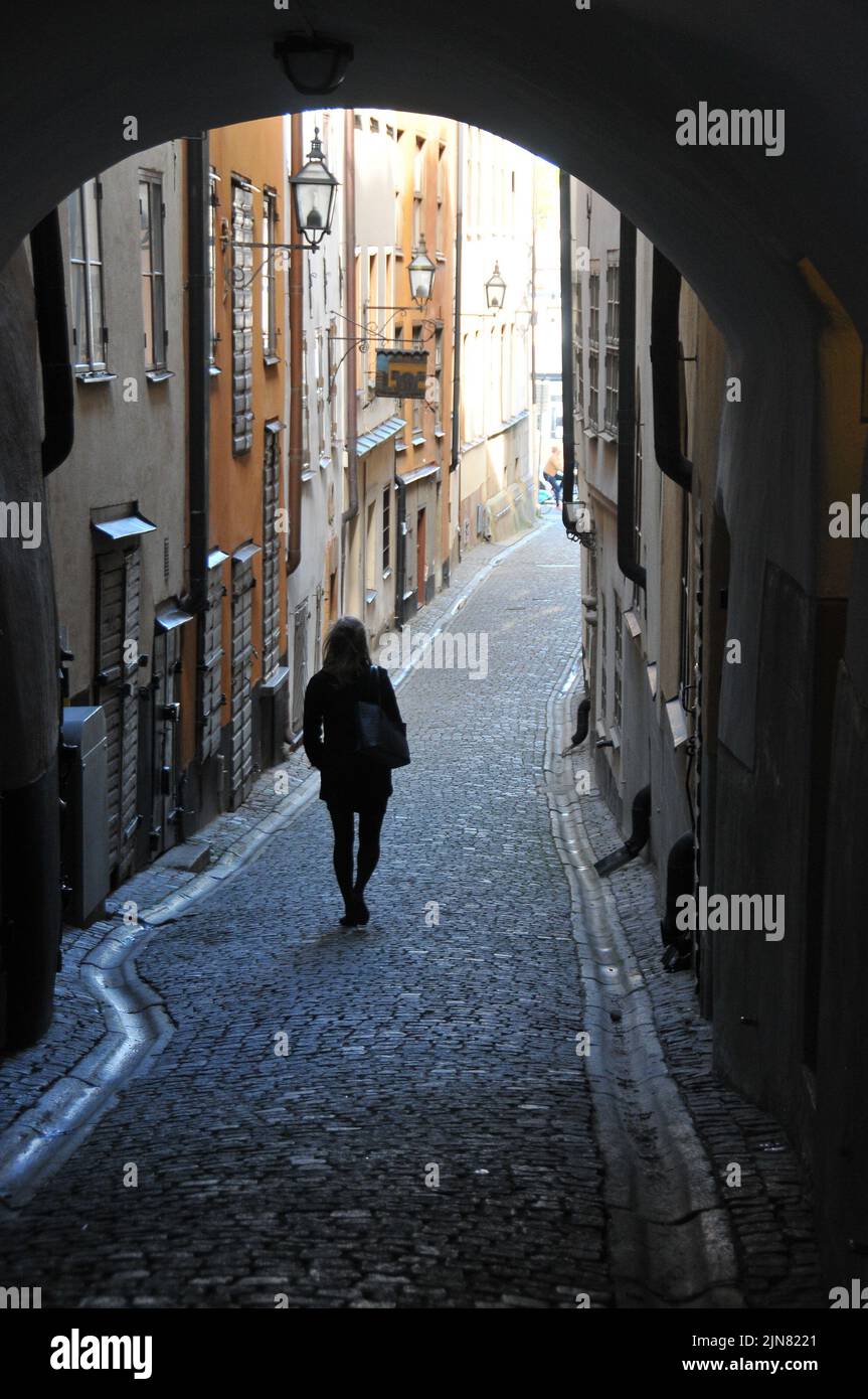 Woman walking bike in narrow hi-res stock photography and images - Alamy