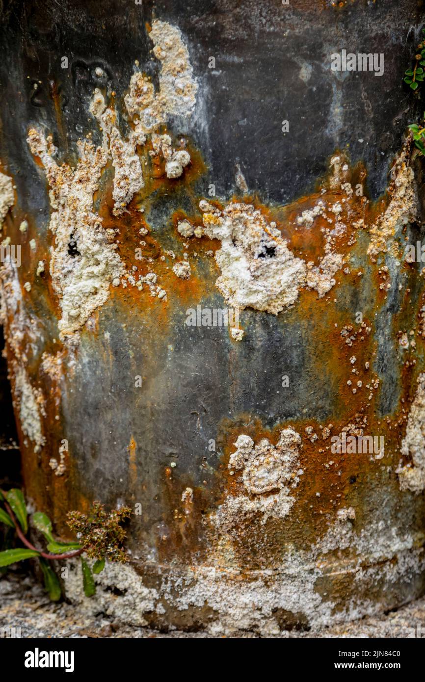 Alkaline on outside of bin which contains fire ash Stock Photo Alamy