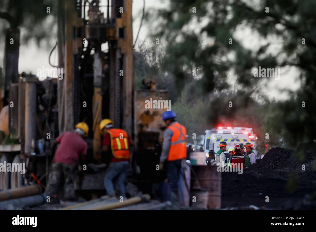 Workers participate in the rescue operation for miners trapped in a coal mine that collapsed in Sabinas, in Coahuila state, Mexico, August 9, 2022. REUTERS/Luis Cortes Stock Photo