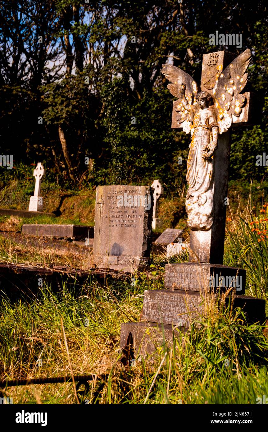 Bias relief angel grave marker in Raheenyhooig Graveyard on the south shore shore of Dingle Harbor in Ireland. Stock Photo