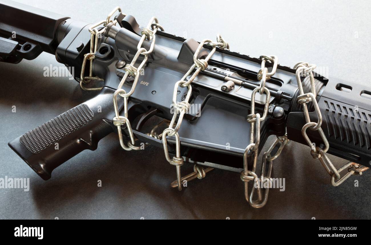 AR-15 with metal chain keeping it locked up Stock Photo