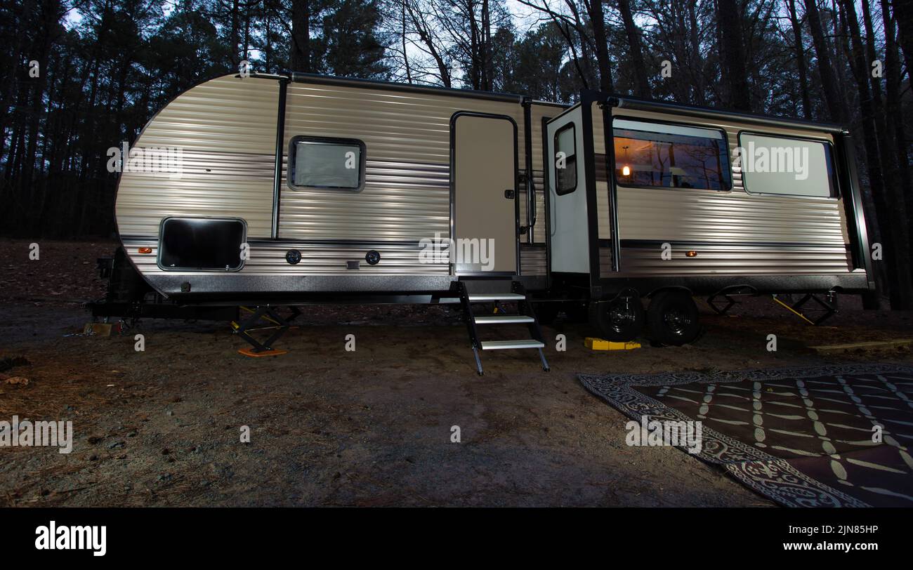 Trailer as night falls in a forest near Jordan Lake in North Carolina Stock Photo