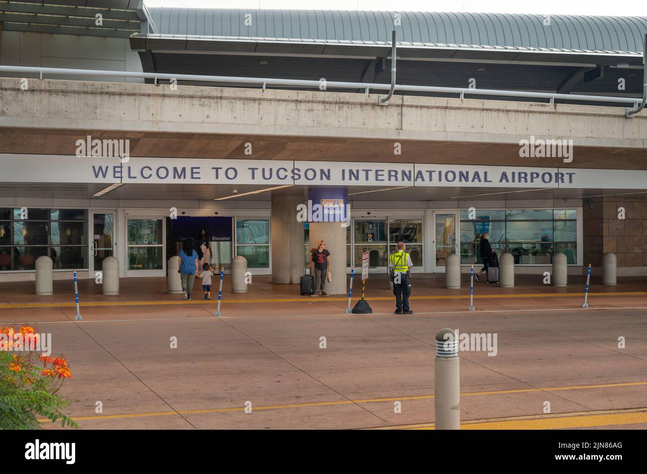 Travelers and passengers in front of Tucson airport terminal.  Stock Photo