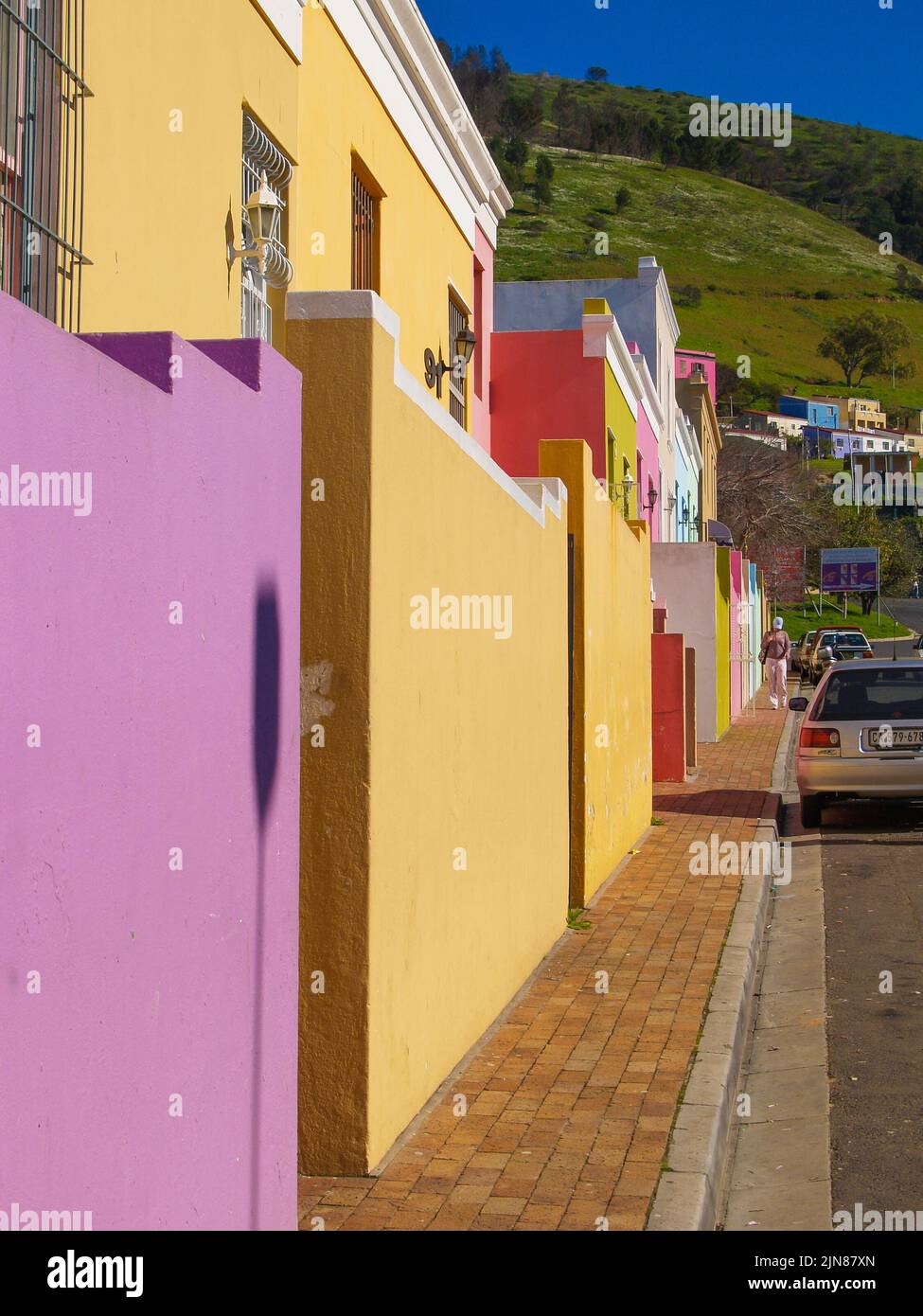 Cape Town South Africa - August 25 2007; Street of distinctive pastel colored buildings in district of Bo-Kaap in Cape Town. Stock Photo