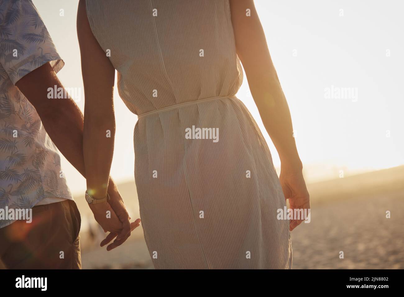Hands and hearts intertwined on this day. an unrecognizable couple holding hands. Stock Photo