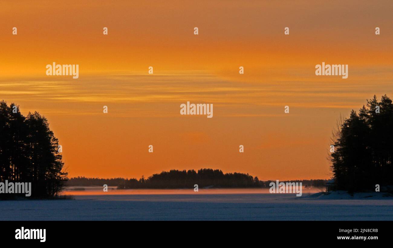 Islands in morning mist. South Kallavesi lake, Kuopio, Finland, 2017-03-19 06:20 +02. Stock Photo