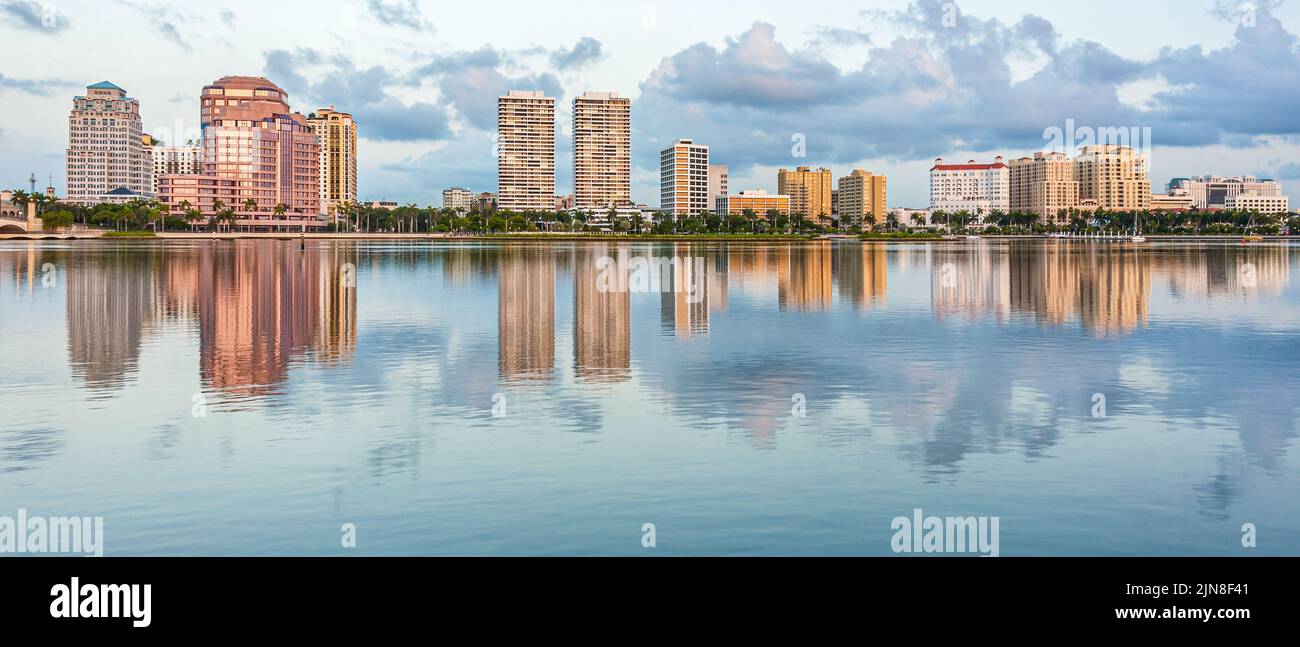 Sunrise skyline view of the West Palm Beach waterfront along Flagler Drive from across the Intracoastal Waterway in Palm Beach, Florida. (USA) Stock Photo