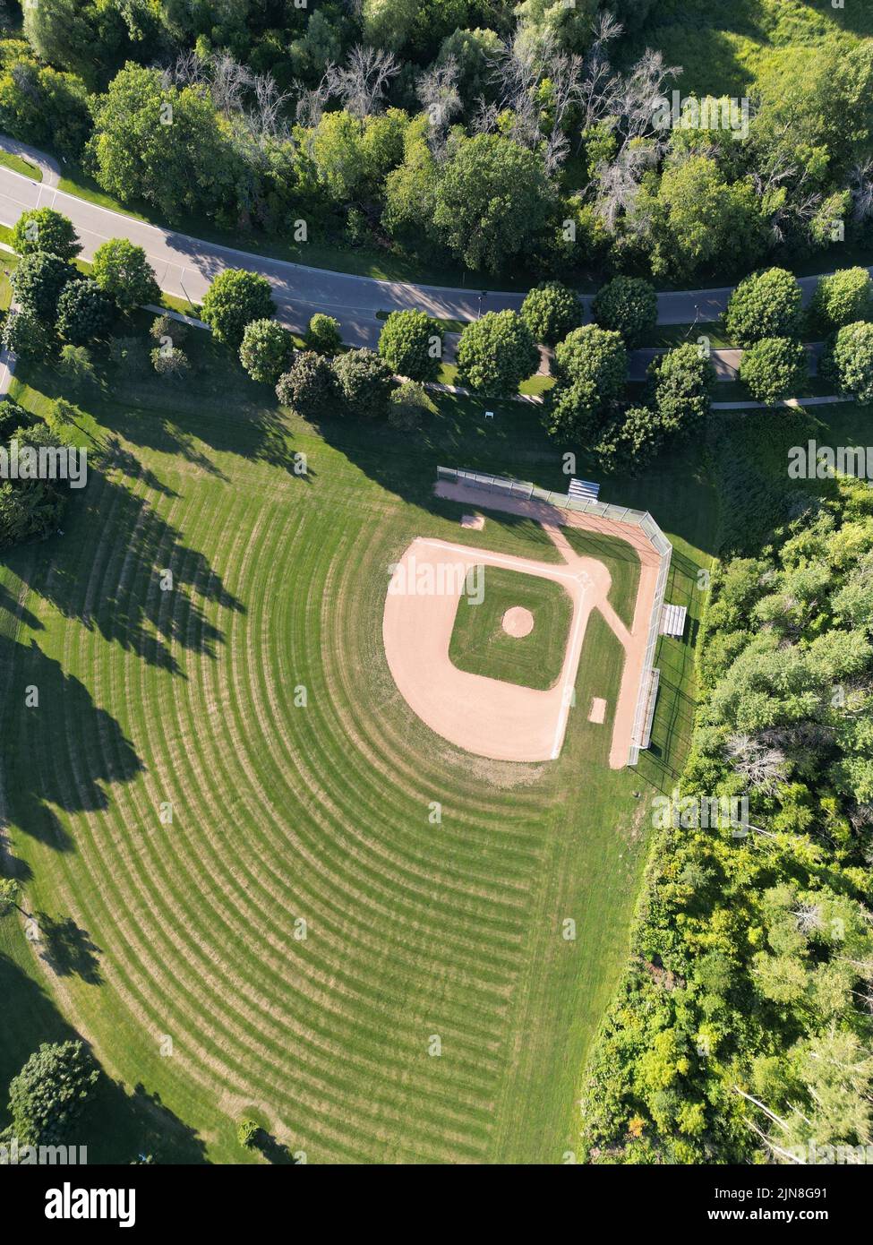 An aerial shot of the Delaware Park Baseball Diamonds in Buffalo city surrounded by lush trees Stock Photo