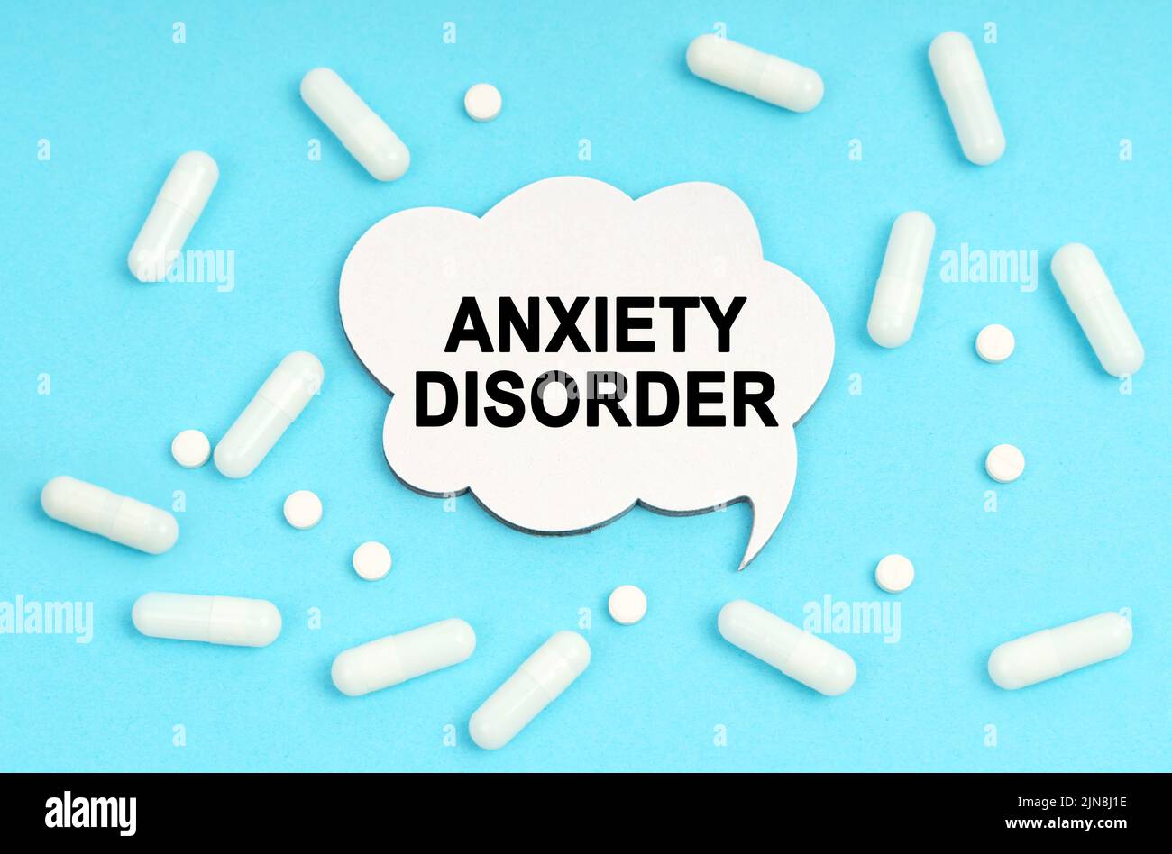 Medicine concept. On a blue background pills and a plate. Inside the