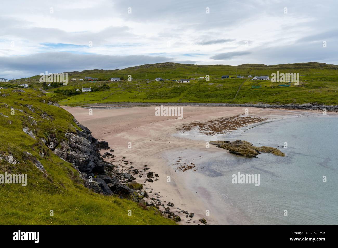 the Scottish Highlands coastline and the beauitful golden pink sand beach of Clashnessie in Sutherland Stock Photo