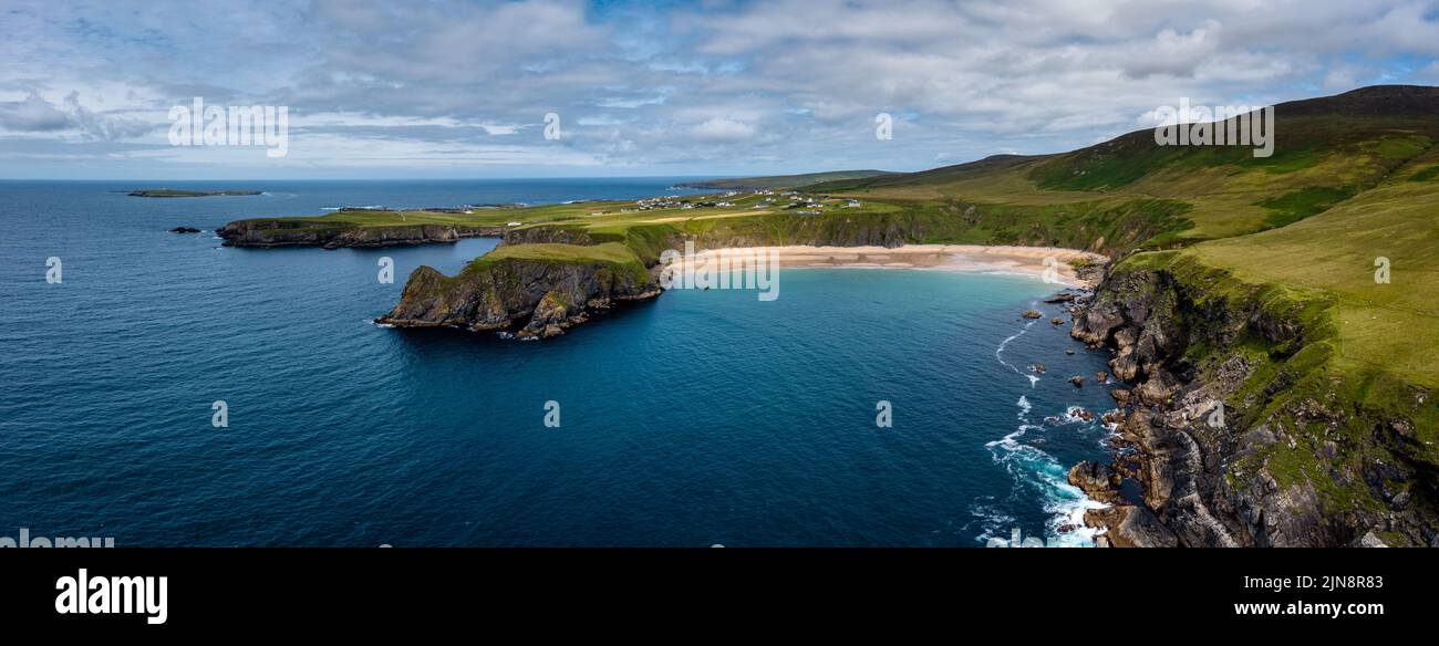 A drone aerial panorama of the beautiful Silver Strand and horseshoe bay at Malin Beg on the Wild Atlantic Way of Ireland Stock Photo