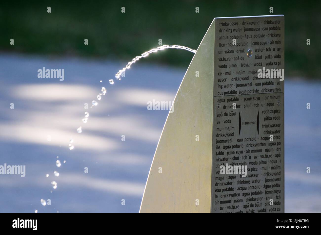 Hanover, Germany. 10th Aug, 2022. Water splashes from a public drinking