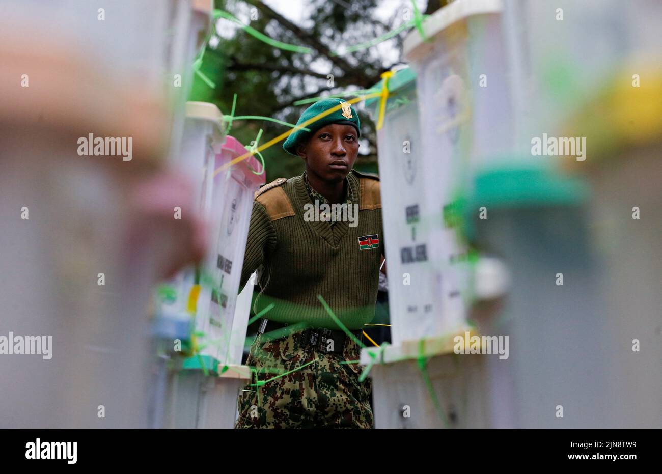 A National Youth Service (NYS) officer stands guard near sealed ballot boxes containing electoral materials at an Independent Electoral and Boundaries Commission (IEBC) tallying centre after the general election in Nairobi, Kenya August 10, 2022. REUTERS/Thomas Mukoya     TPX IMAGES OF THE DAY Stock Photo