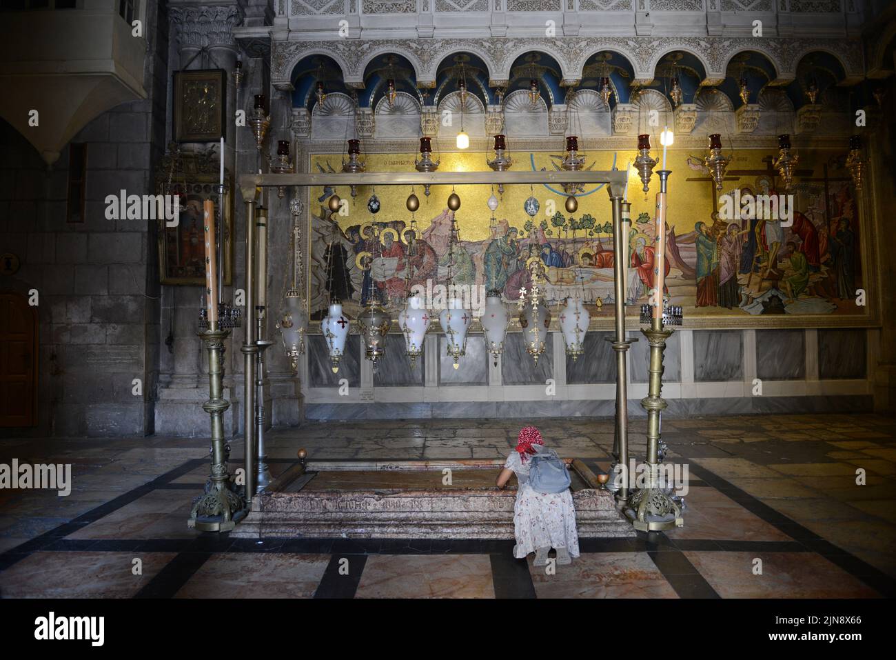 The Stone of Anointing inside the church of the holy Sepulchre in the old city of Jerusalem. Stock Photo